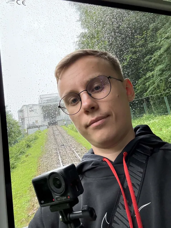 Riding a mountain funicular in the rain, action camera mounted on the window rail