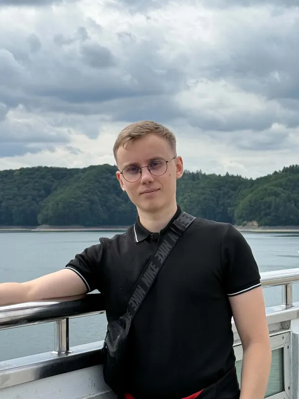 On board a cruise on Lake Solina, wooded hills of the Bieszczady in the background